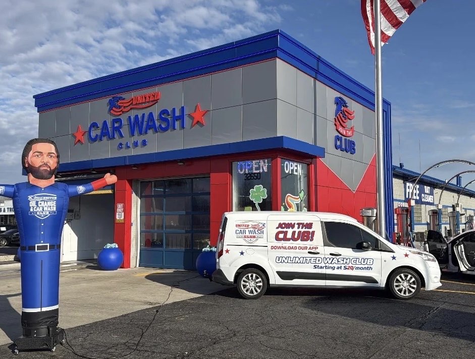 United Car Wash Club building with an inflatable mascot